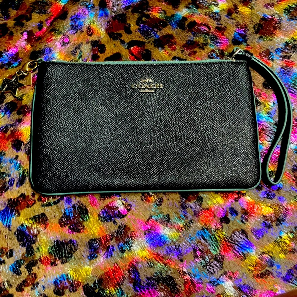 Deep navy blue Coach wristlet